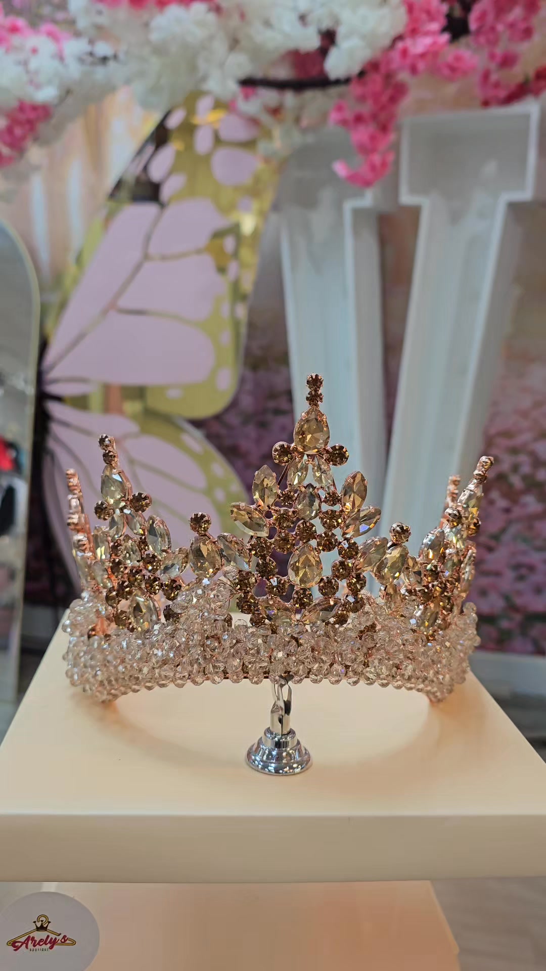 Close-up of a rose gold quinceañera crown.