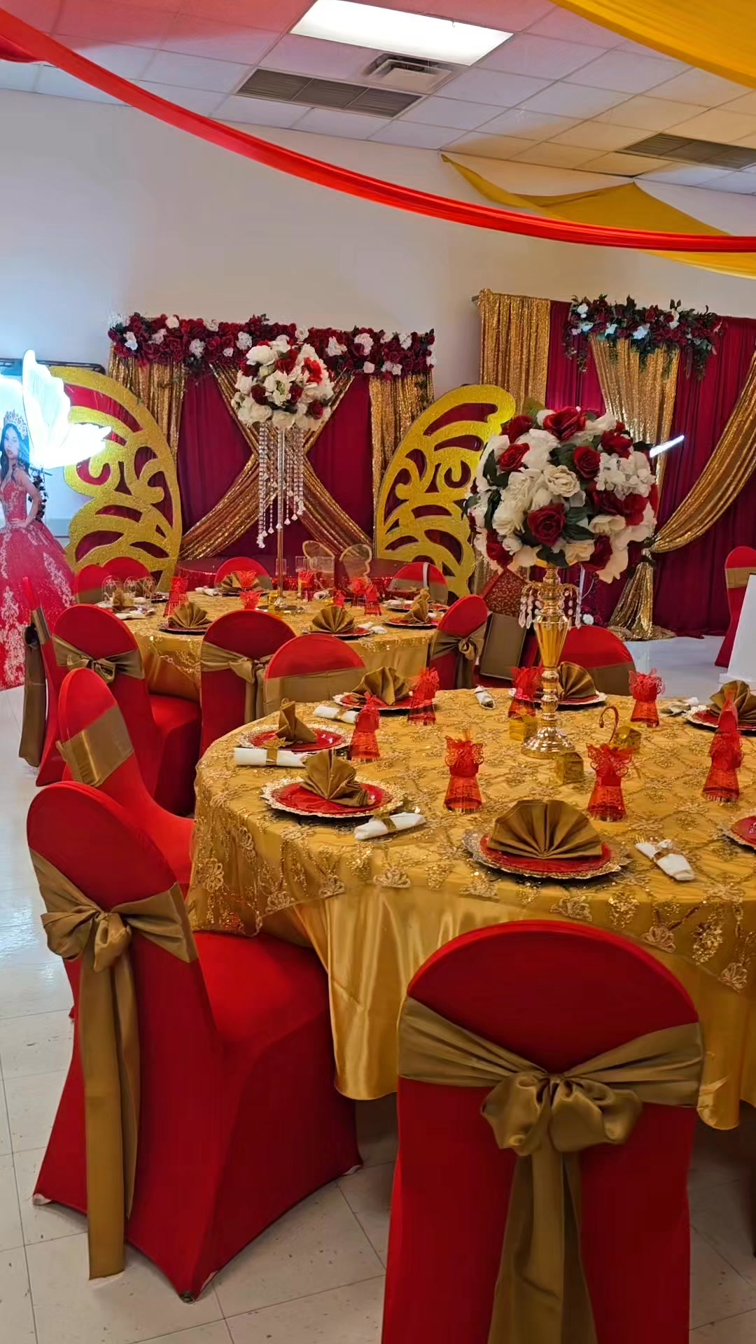 Decorated quinceañera table setup with floral details.